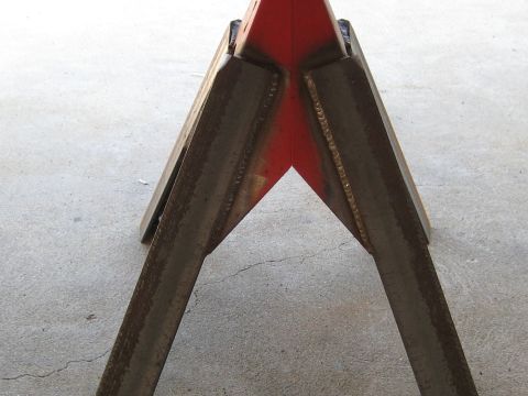 1996 Ford Bronco - Welded metal jack stands are shown on a concrete surface.