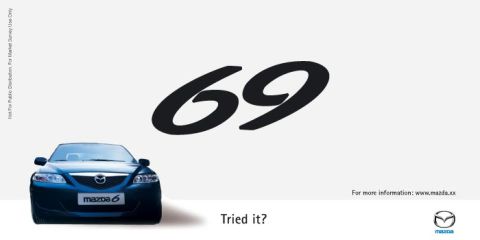 2003 Mazda 6 - A blue Mazda 6 is shown from the front with the number 69 prominently displayed.