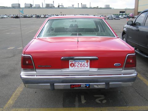 1991 Ford LTD Crown Victoria - Rear view of a red Ford LTD Crown Victoria with Massachusetts plate F2663 and a DARE bumper sticker.