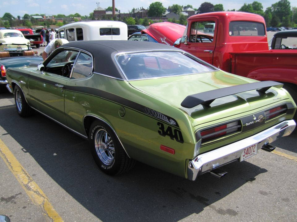 Green Plymouth Duster 340 fastback rear quarter view at a car show