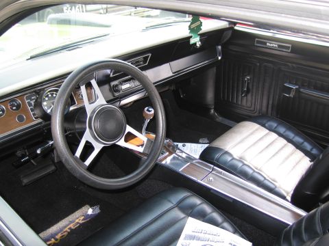 1991 Ford LTD Crown Victoria - Duster interior features a black sport steering wheel, woodgrain dash, console shifter and two-tone bucket seats.