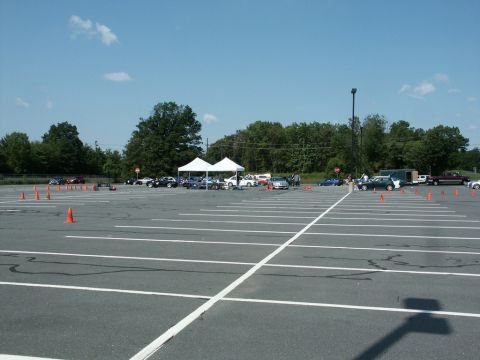 2001 Mercury Grand Marquis - Wide photograph of an autocross course marked with orange cones in a large empty parking lot.