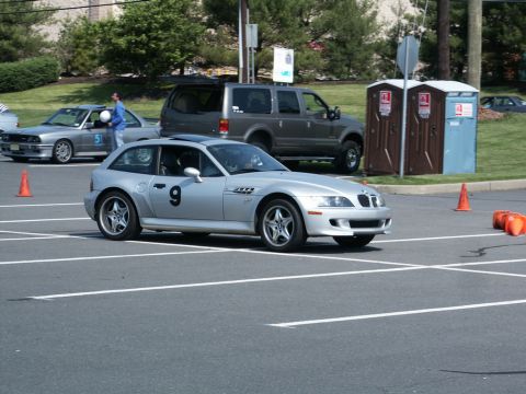 2001 Mercury Grand Marquis - Photograph of a silver BMW Z3 coupe numbered 9 driving through an orange-coned autocross course.