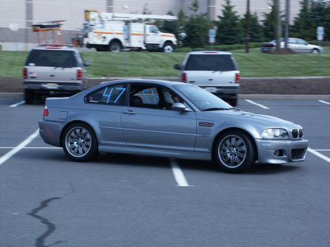 2001 Mercury Grand Marquis - Photo of a gray BMW E46 M3 coupe, number 47, cornering at an autocross event.