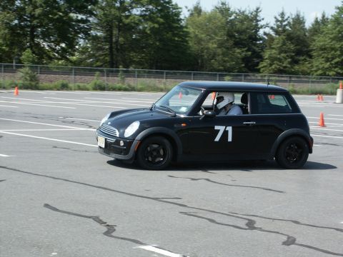 2001 Mercury Grand Marquis - Action photo of a black Mini Cooper, number 71, running an autocross course.