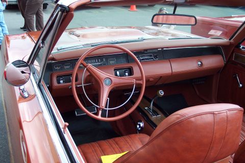 2001 Ford Crown Victoria - The interior of a classic convertible with brown leather seats and dashboard is shown from the driver's side. The steering wheel, instrumen…