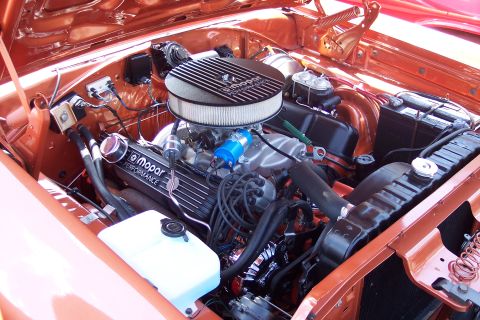 2001 Ford Crown Victoria - Engine bay a Mopar Performance engine with a chrome air cleaner and orange paint.