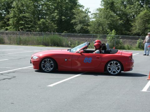 2001 Mercury Grand Marquis - A red convertible with racing numbers participates in an autocross event.