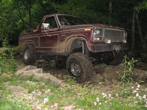 1980 Ford Bronco - This 1980 Ford Bronco is shown off-roading over a rocky path.