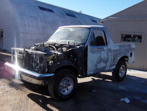 1987 Ford Bronco - This 1987 Ford Bronco is undergoing restoration, with its front end disassembled and body primed.