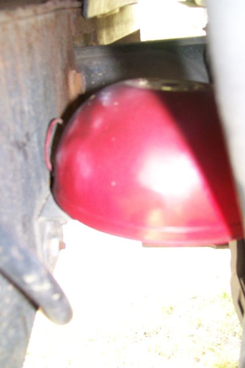 1992 Ford C-350 (Centurion Conversions) - A red oil filter is visible, likely part of a vehicle's engine maintenance.