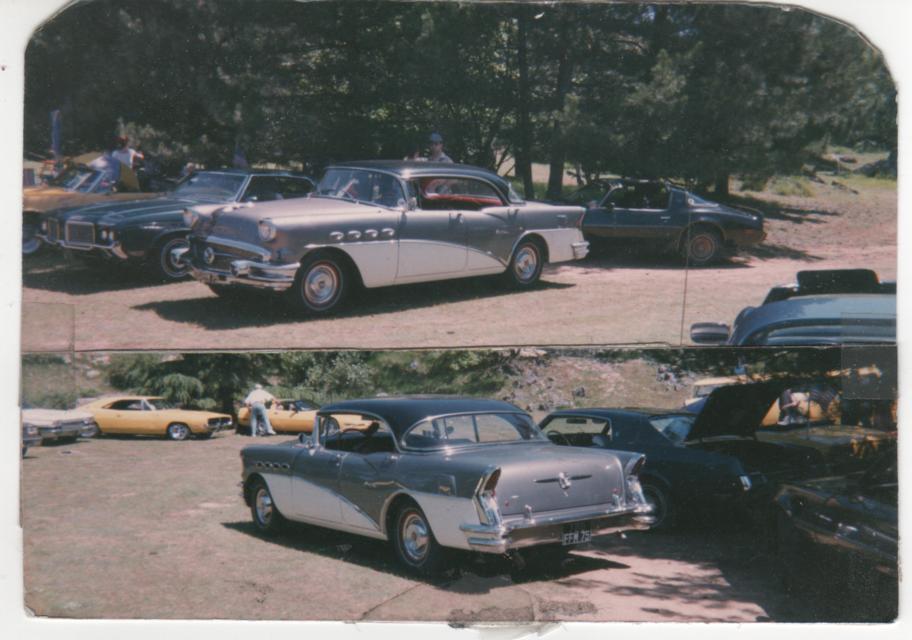 Old print photo of vintage Buick cars parked at a mountain car show