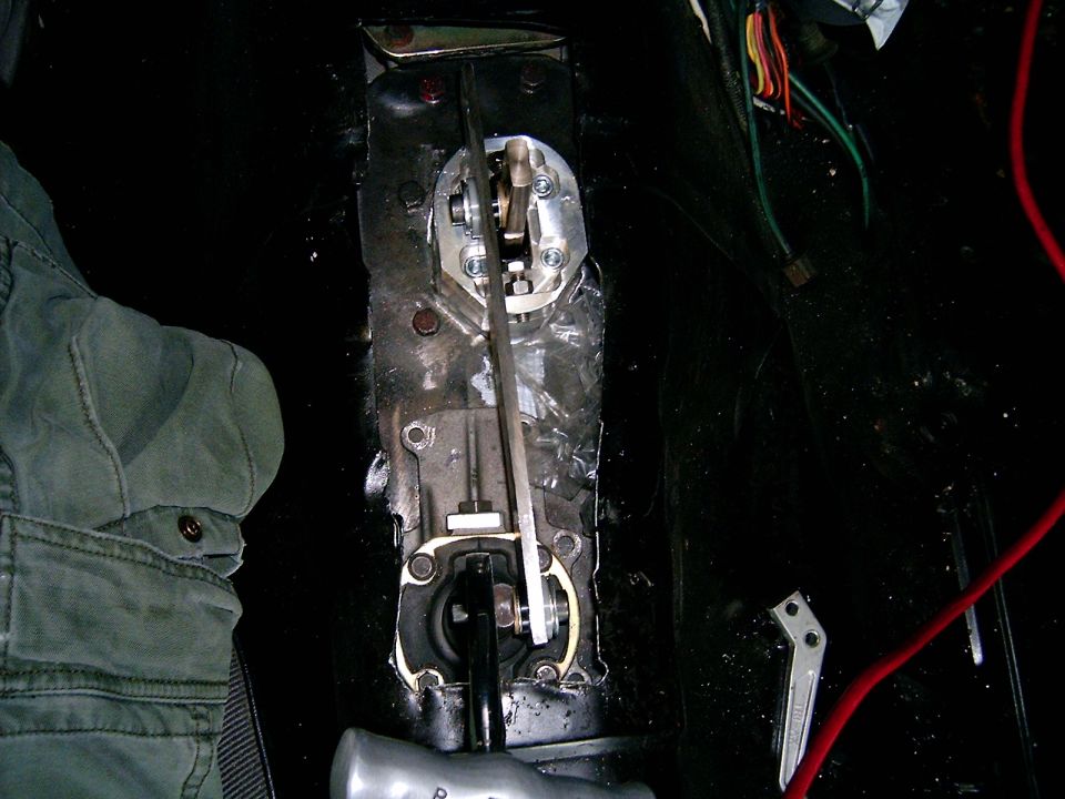 Manual transmission shifter mechanism in a vehicle.