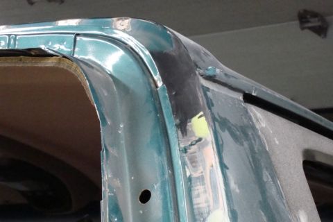 1996 Ford Bronco - Close-up photograph of a painted vehicle roofline corner during restoration, not a technical document.