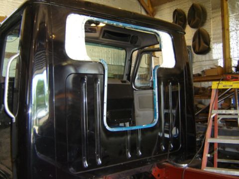 1992 Ford Bronco - Photograph of a truck cab shell during restoration, not a technical document.