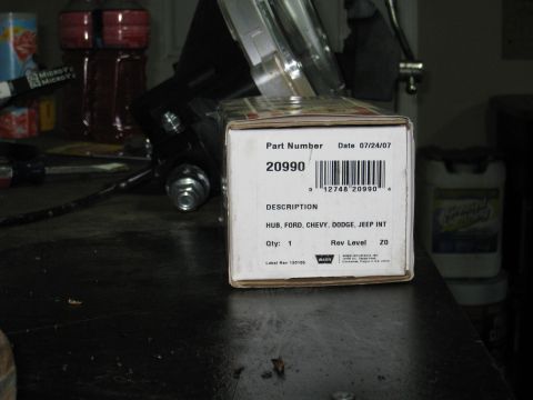1996 Ford Bronco - A close-up view of a white cardboard box with product information printed on it. The box is labeled with a part number, date, description,…