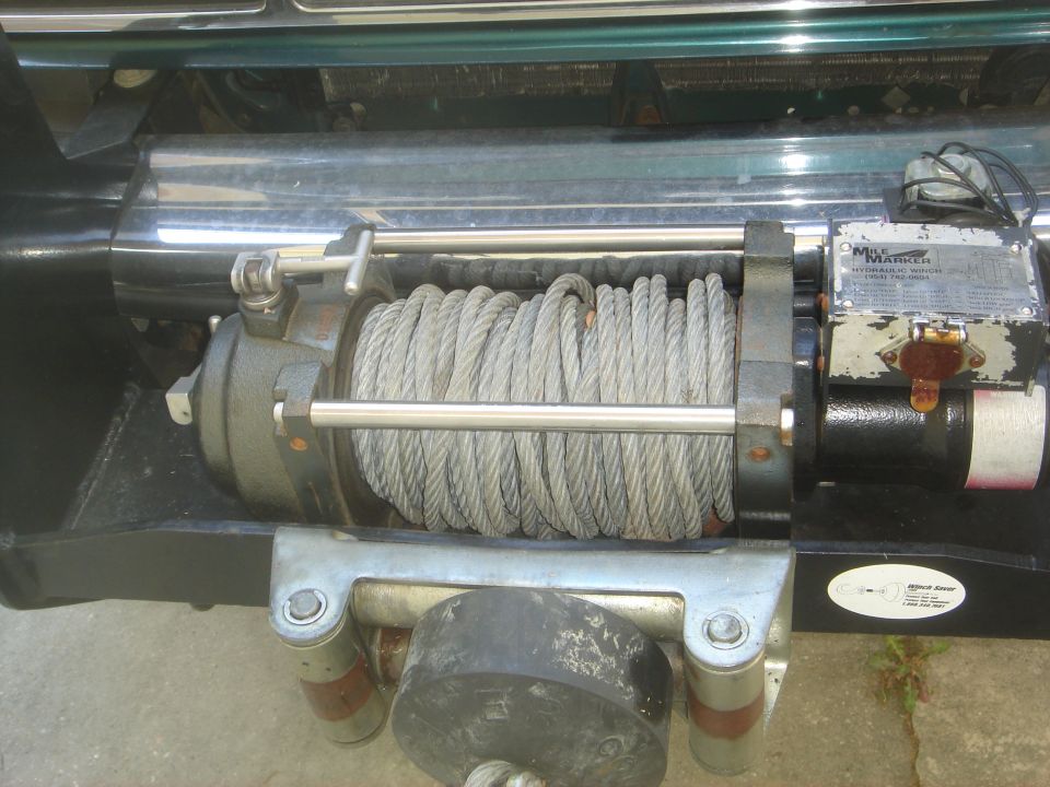 Close-up of a V8 engine block with pulleys and belts