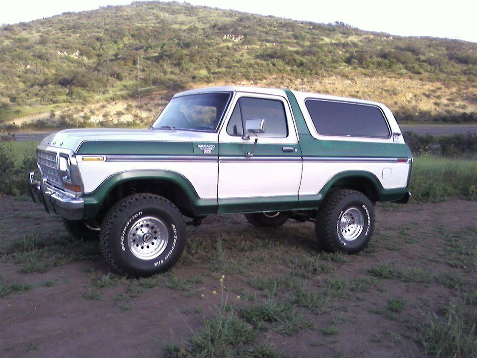 1978 Ford Bronco, white and green, lifted with off-road tires