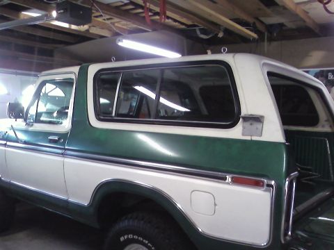 1978 Ford Bronco - This 1978 Ford Bronco features a distinctive green and white two-tone paint scheme and is viewed from the side.