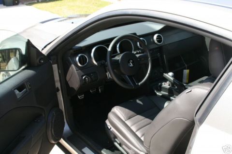 2008 Ford Mustang - Interior view of a 2008 Ford Mustang, showing the dashboard, steering wheel, and driver's seat.