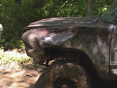1980 Dodge Magnum - This heavily damaged pickup truck is covered in mud, suggesting it has been off-roading.