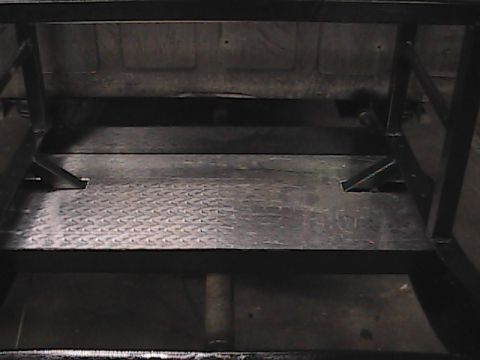 1980 Dodge Magnum - Interior view of a truck bed modified with diamond plate flooring and a metal frame.