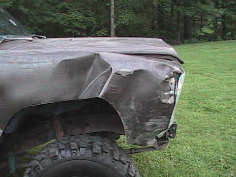 1980 Dodge Magnum - A heavily damaged truck fender and hood are shown from a 3/4 front angle, with a Supermotors.net watermark in the lower right corner.