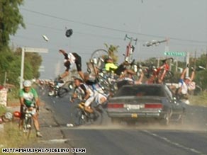 1987 Suzuki Samurai - A car is caught in a chaotic scene with numerous bicycles and cyclists involved in a crash.