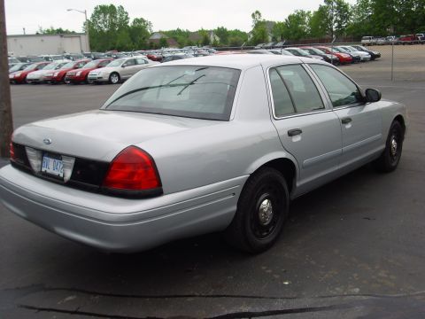 2004 Ford Crown Victoria - This silver 2004 Ford Crown Victoria is shown from the rear 3/4 angle in a parking lot.