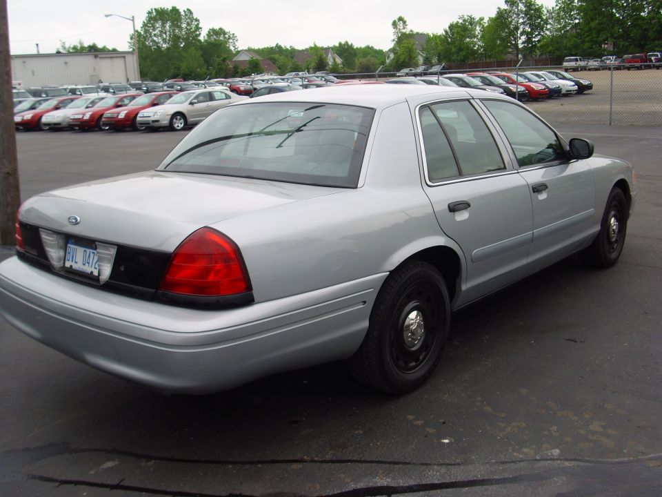 Silver 2004 Ford Crown Victoria rear 3/4 view