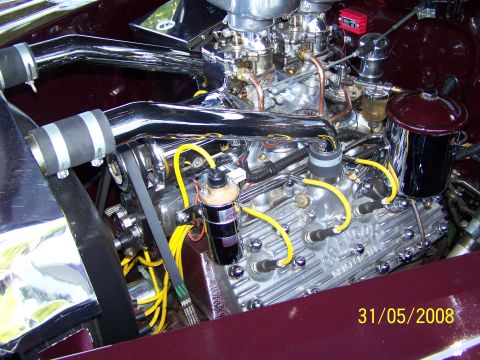 1972 Ford Ranchero - Engine bay details with shiny chrome components and bright yellow wiring are visible.