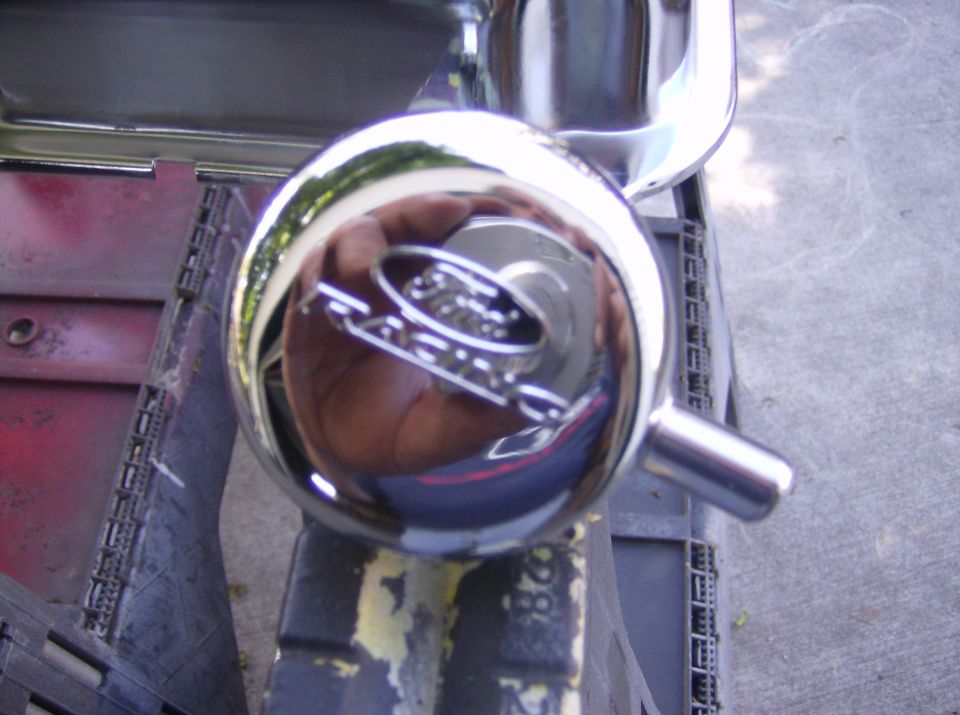 Chrome knob with Ford Ranchero emblem reflected in it. Part of a 1970 Ford Ranchero