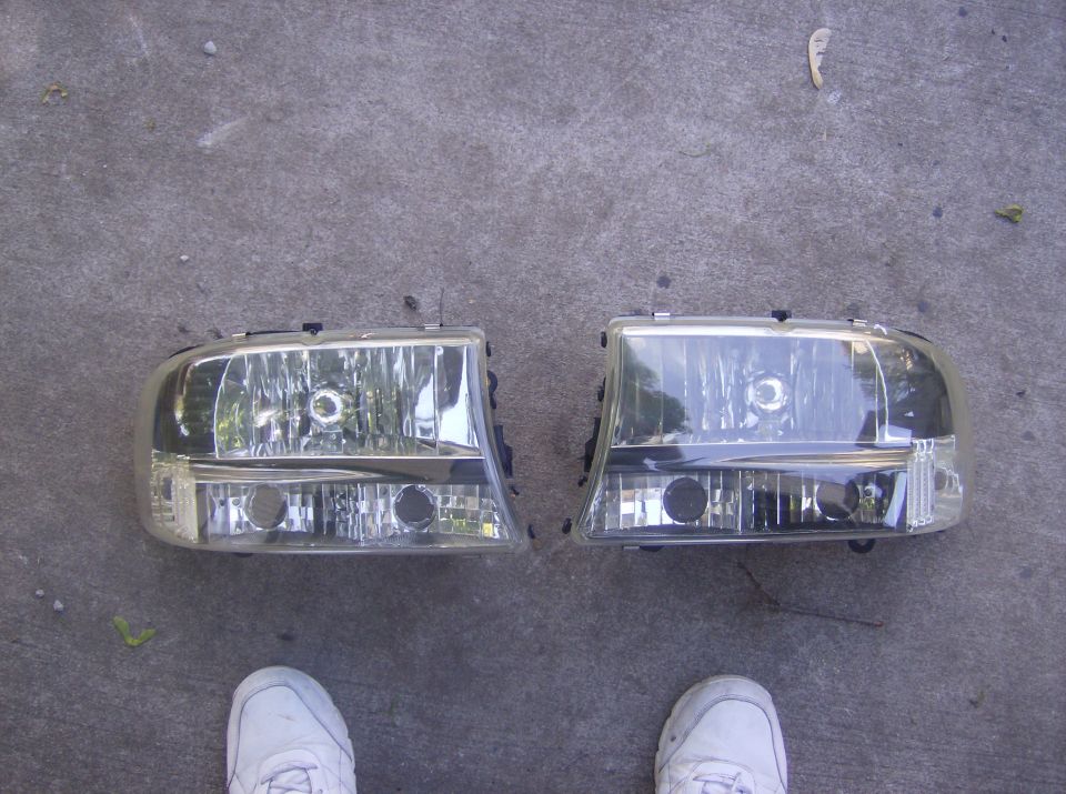 Pair of headlights on concrete ground