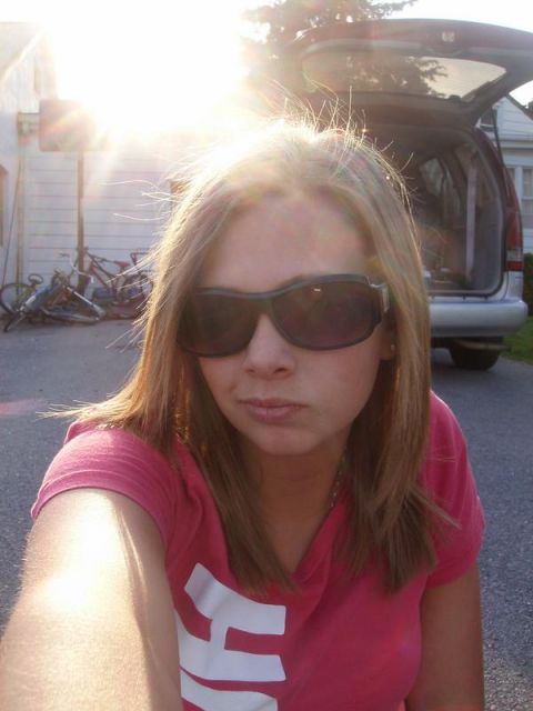 1997 Dodge 1500 - Woman takes a selfie with a van and bicycles in the background.