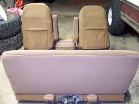 1991 Ford Bronco - The tan interior seats and center console have been removed from the vehicle.