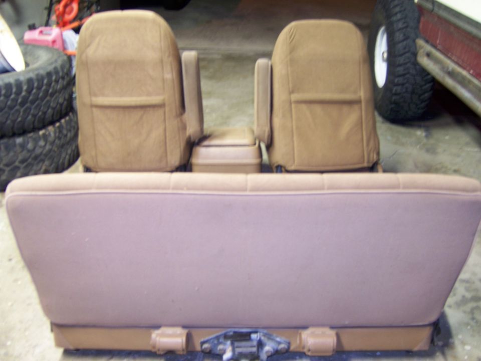 Tan interior seats and console removed from a vehicle