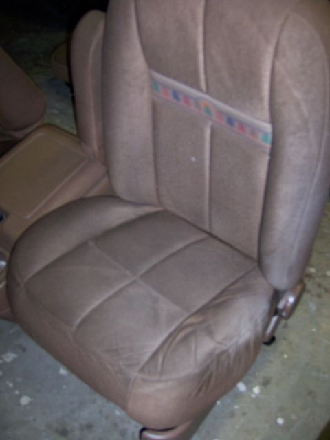 1991 Ford Bronco - A close-up view of a car's interior seat, showing its fabric texture and a decorative stripe.