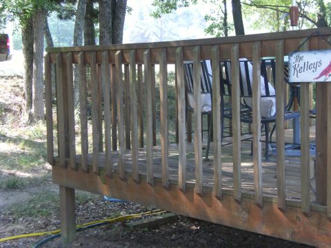 1992 Ford F-150 - A truck is visible to the left of a wooden deck with chairs.