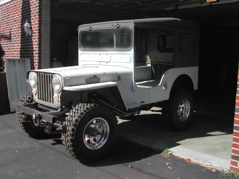 1948 Jeep Wrangler - This 1948 Jeep CJ-3A is shown in a garage with a hardtop and appears to be undergoing body work.