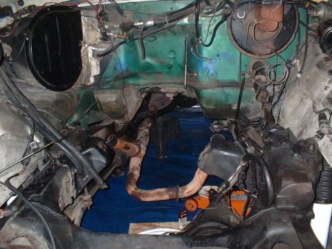 1978 Ford Bronco - Undercarriage and engine bay of a vehicle, showing exhaust system and steering components.