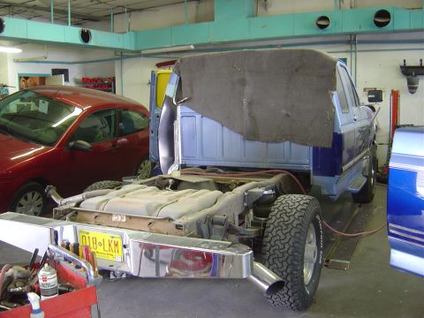 1996 Ford F-250 - This 1996 Ford F-250 is in a garage with its bed removed for work.
