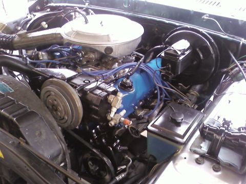 1978 Ford Bronco - Close-up view of the engine bay in a 1978 Ford Bronco, showing the engine components and wiring.