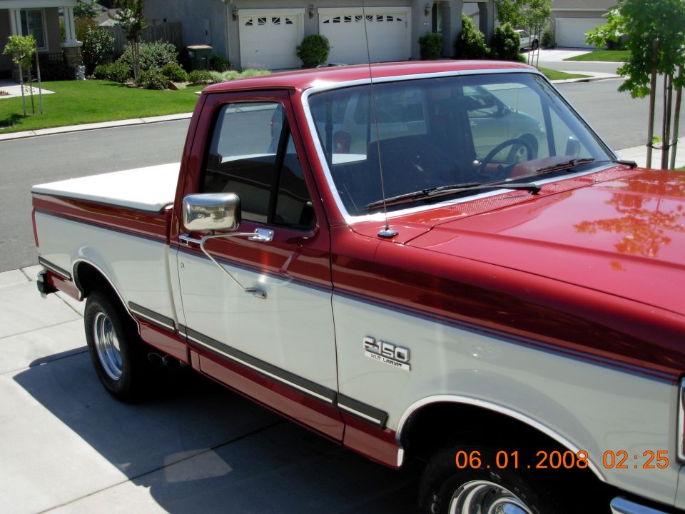 Red and white 1988 Ford F-150 pickup truck, 3q-front view