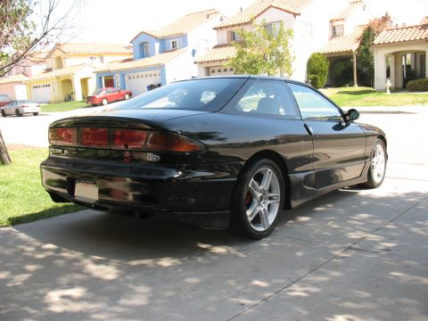 1995 Ford Probe - This 1995 Ford Probe is captured from a rear angle, its distinctive taillights and coupe body style.