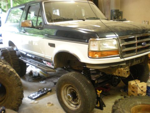 1993 Ford Bronco - This 1993 Ford Bronco features a two-tone paint scheme and is shown with its suspension lifted for off-road use.