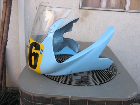 2005 Yamaha R1 - A light blue motorcycle fairing with a clear windscreen and a yellow number plate displaying the number 6 is shown.