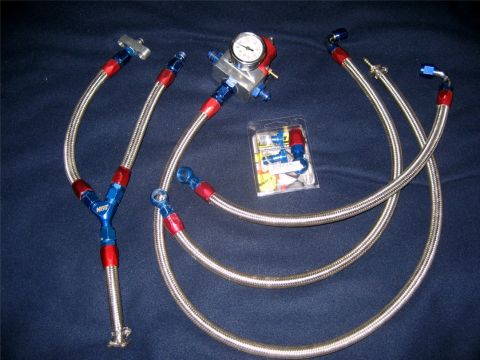 1993 Ford Probe - This automotive part is a fuel pressure regulator with braided lines and a gauge, along with a separate bag of fittings.