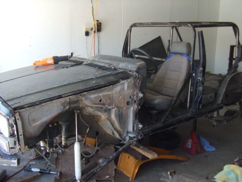 1994 Jeep Cherokee - This 1994 Jeep Cherokee is in a state of disassembly, with its body removed from the chassis.
