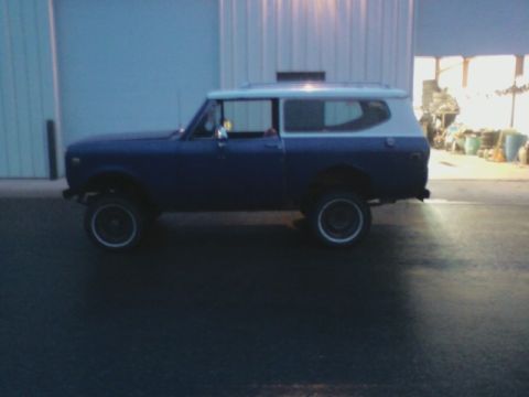 1992 Ford F-350 - Side view of a two-tone blue and white International Harvester Scout II.