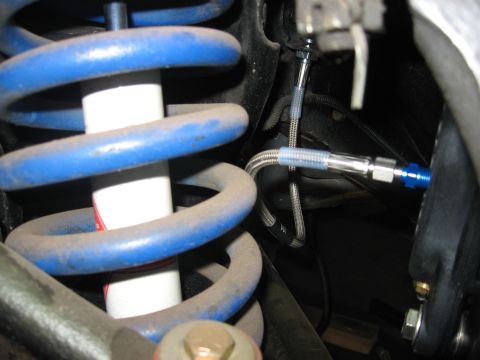 1978 Ford Mustang II - This is a close-up view of a vehicle's suspension and brake system components.